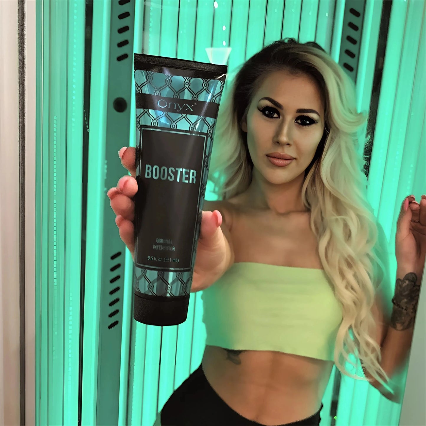 Tanning bed shot with Onyx Booster lotion, ideal for both sunbed and outdoor tanning.