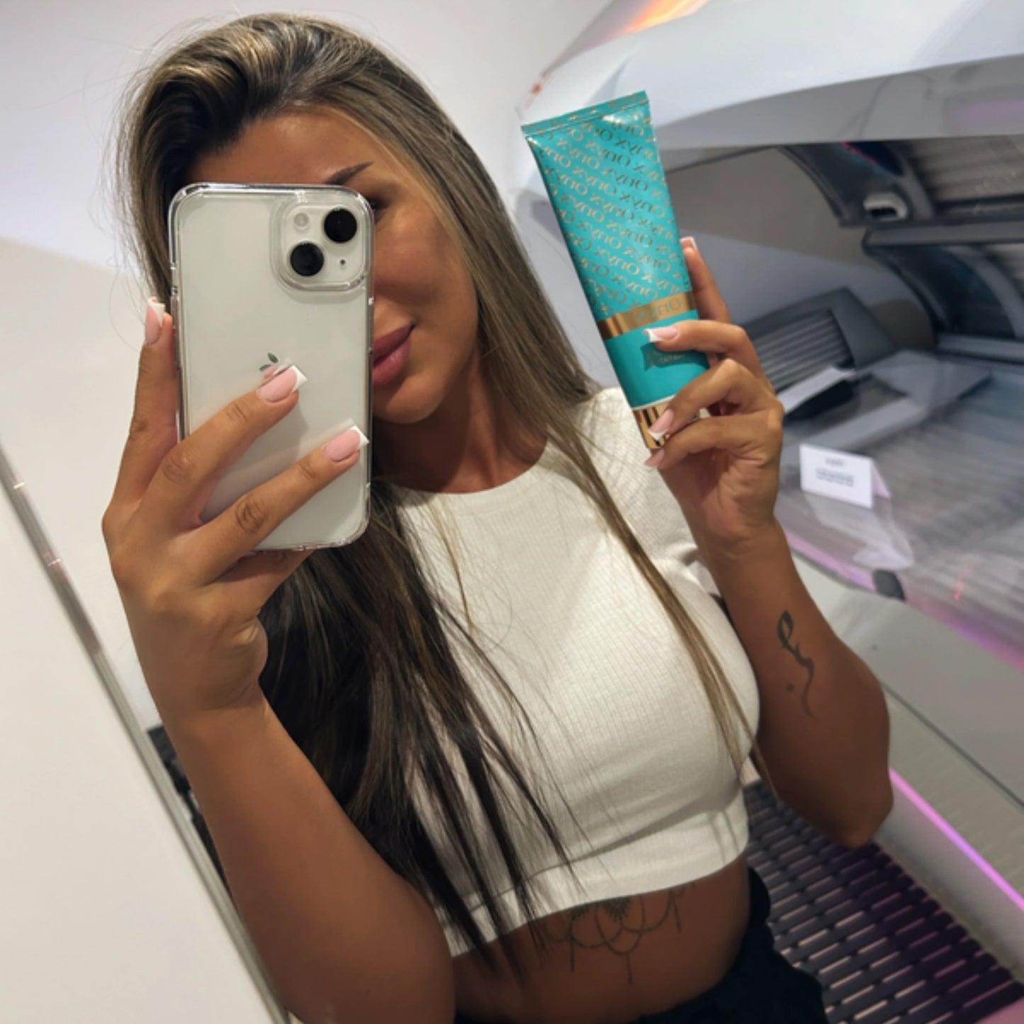 Onyx Dark Tanning Accelerator inside a tanning bed, designed to boost melanin production for a deep, golden tan.