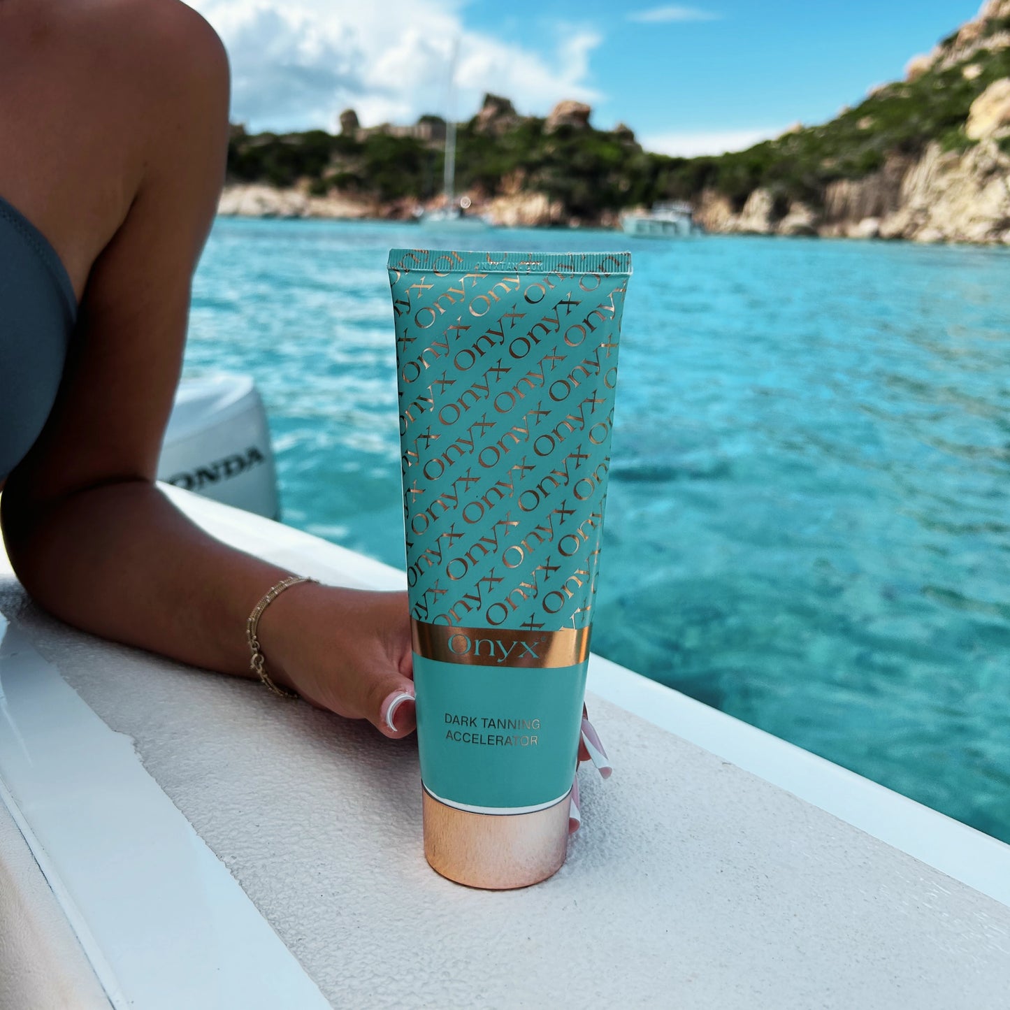 Onyx Dark Tanning Accelerator positioned before a tanning session, maximizing UV absorption for a rich tan.