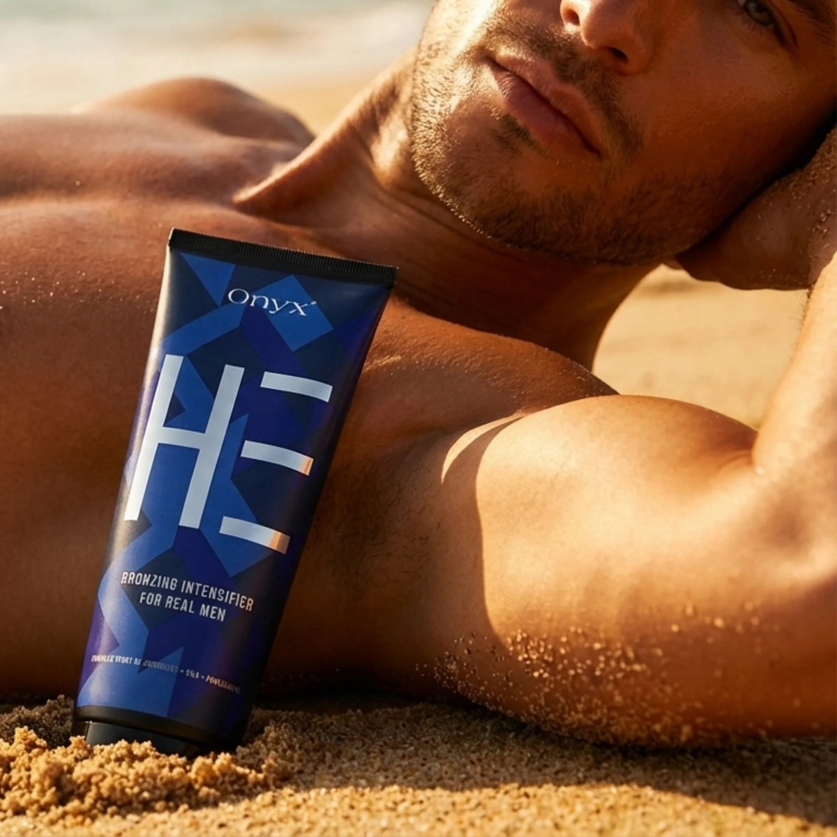Onyx HE tanning lotion placed on the sand next to a man relaxing on the beach
