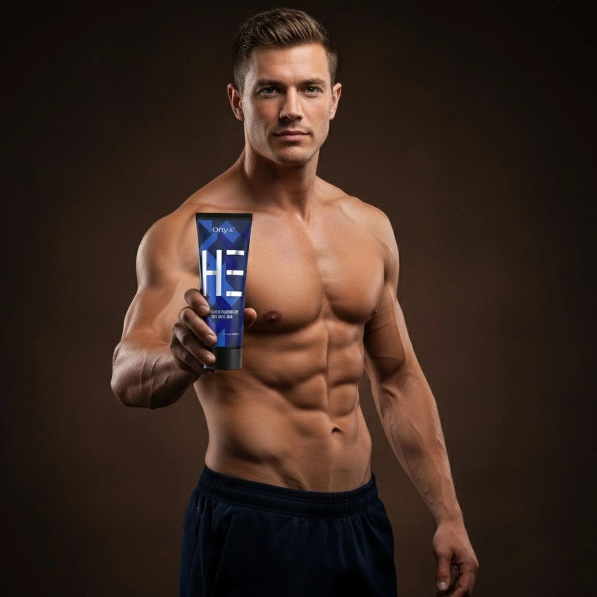 Muscular man presenting Onyx HE tanning lotion against a dark background