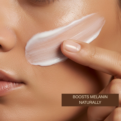 Woman in a bathroom applying AntiAging Face Tanning Lotion to her face while holding the bottle.