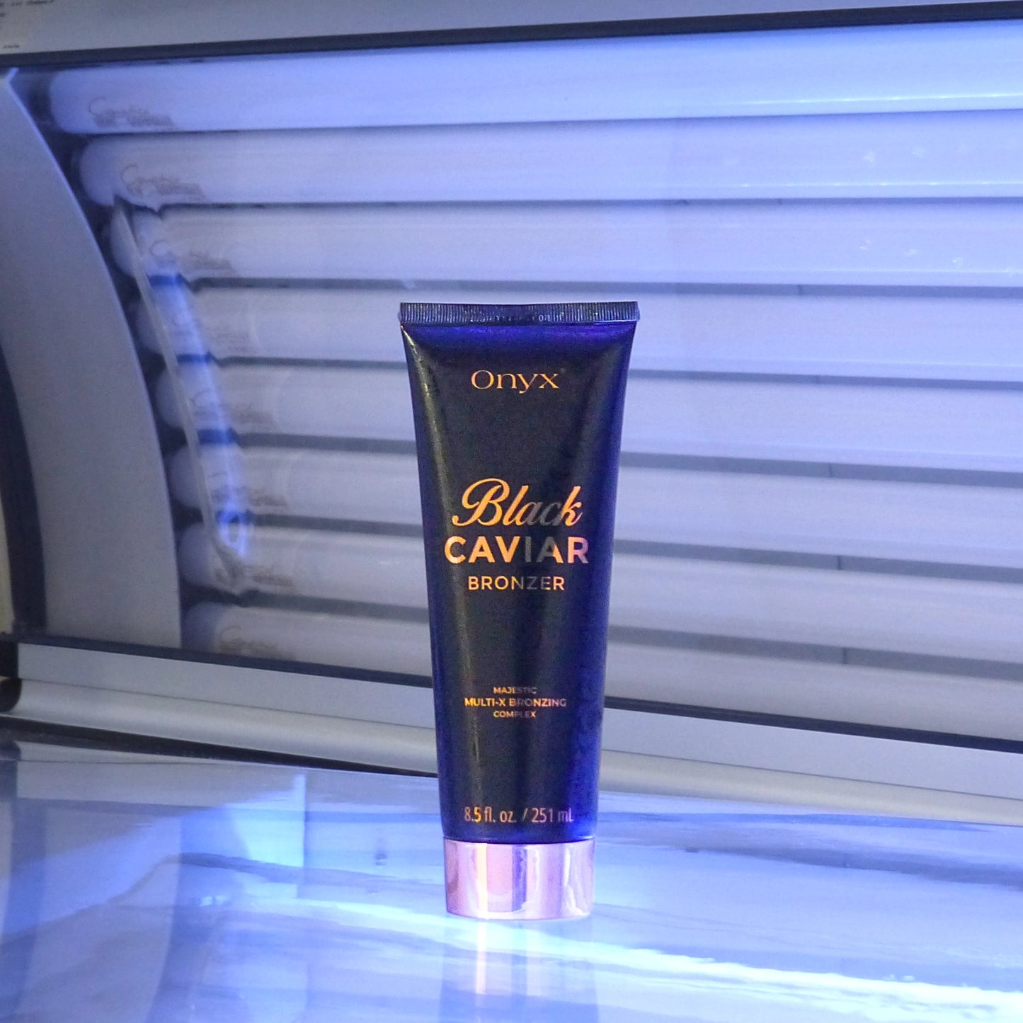 Onyx Black Caviar Bronzing Accelerator, a luxurious tanning lotion with a multi-X bronzing complex, showcased for deep, golden tan results.