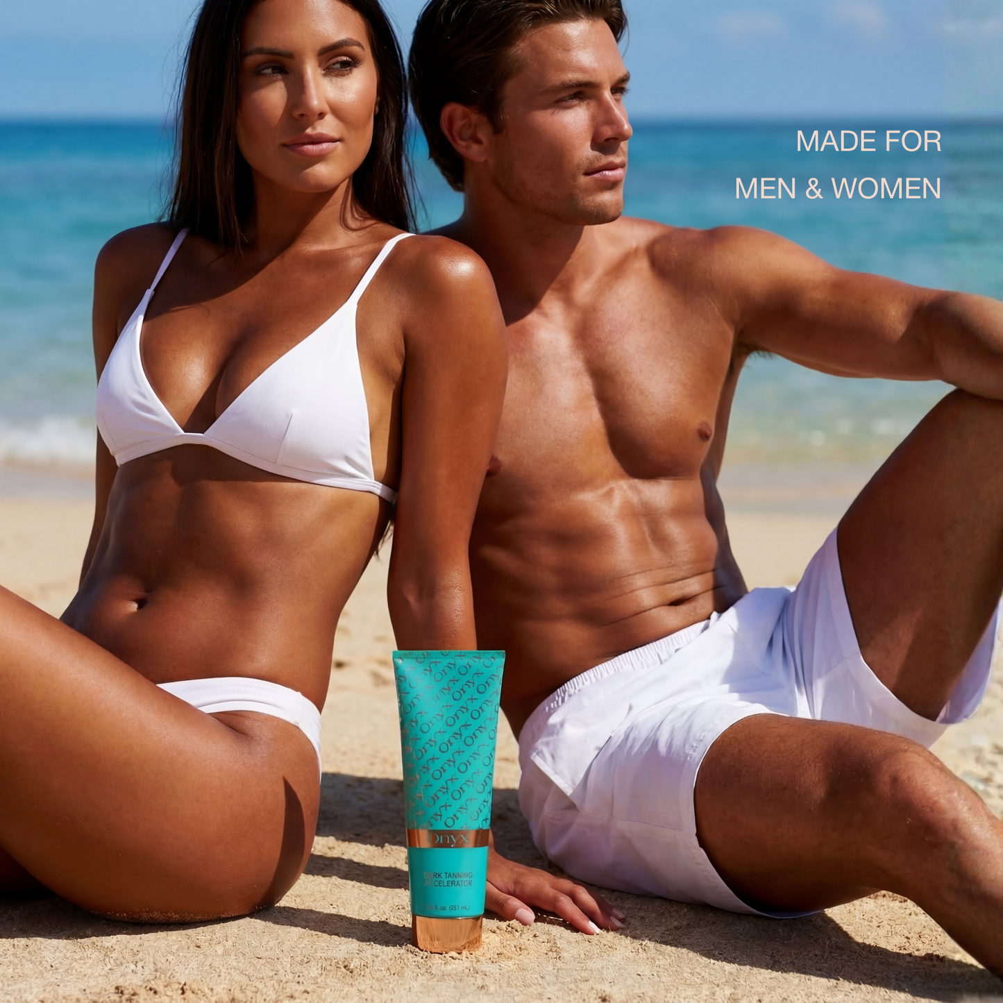 Tanned man and woman sitting on a beach in white swimwear with a tube of Onyx Dark Tanning Accelerator placed between them.