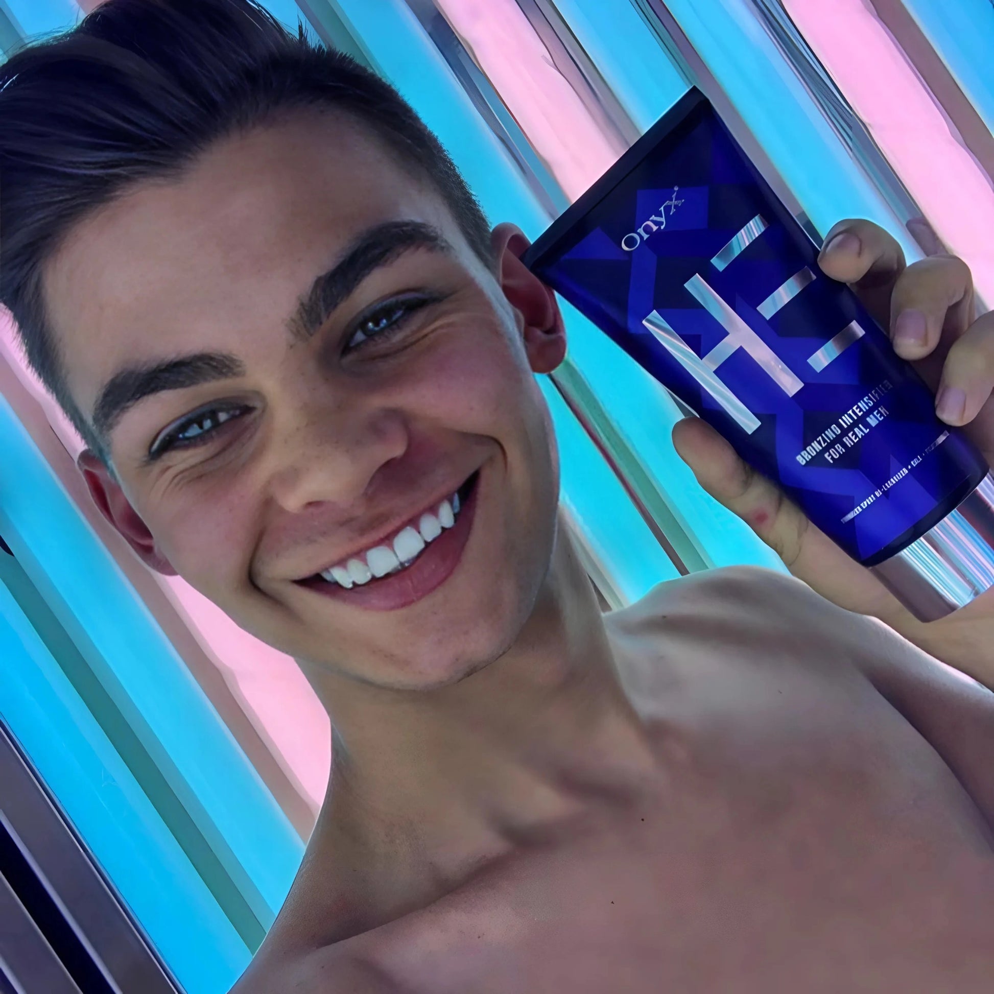 Man using Onyx HE Bronzing Lotion in a UV tanning bed – skin-enhancing indoor tanning maximizer.