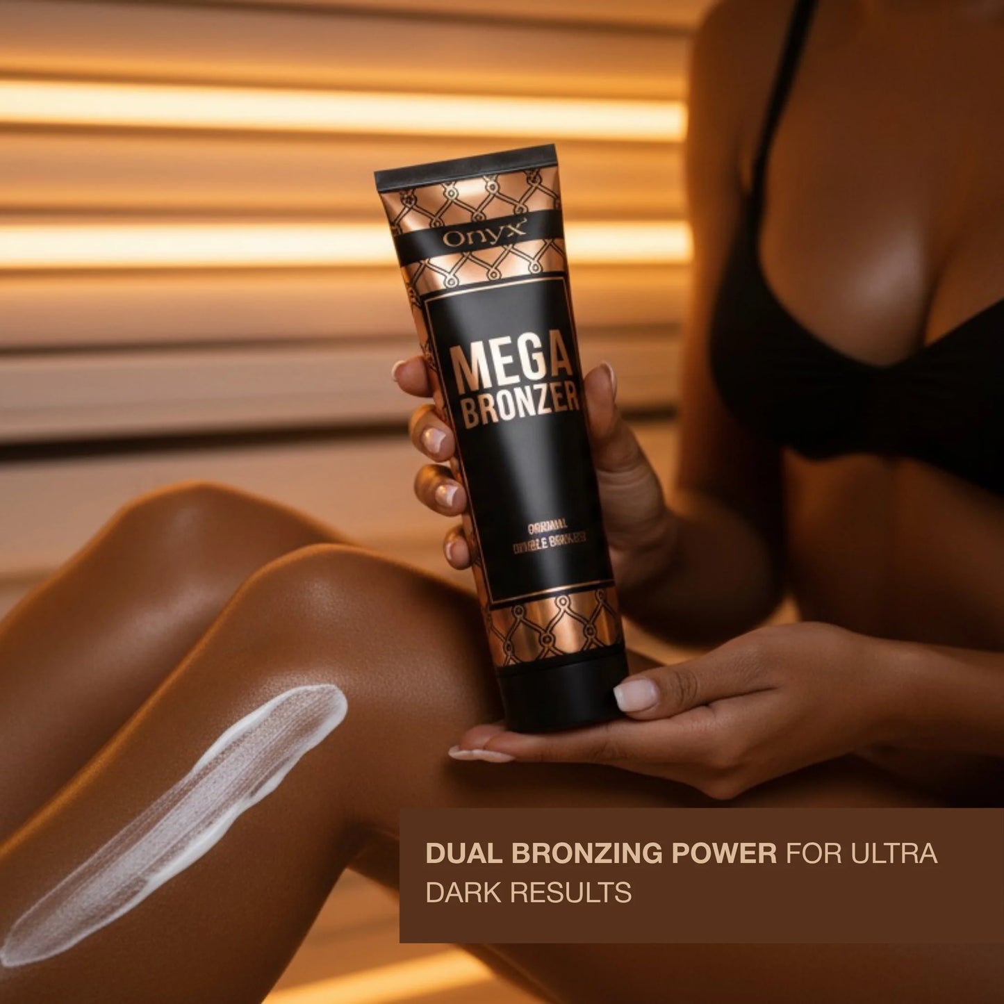 Close-up of Mega Bronzer lotion applied on leg, smooth creamy texture highlighted under warm tanning light.