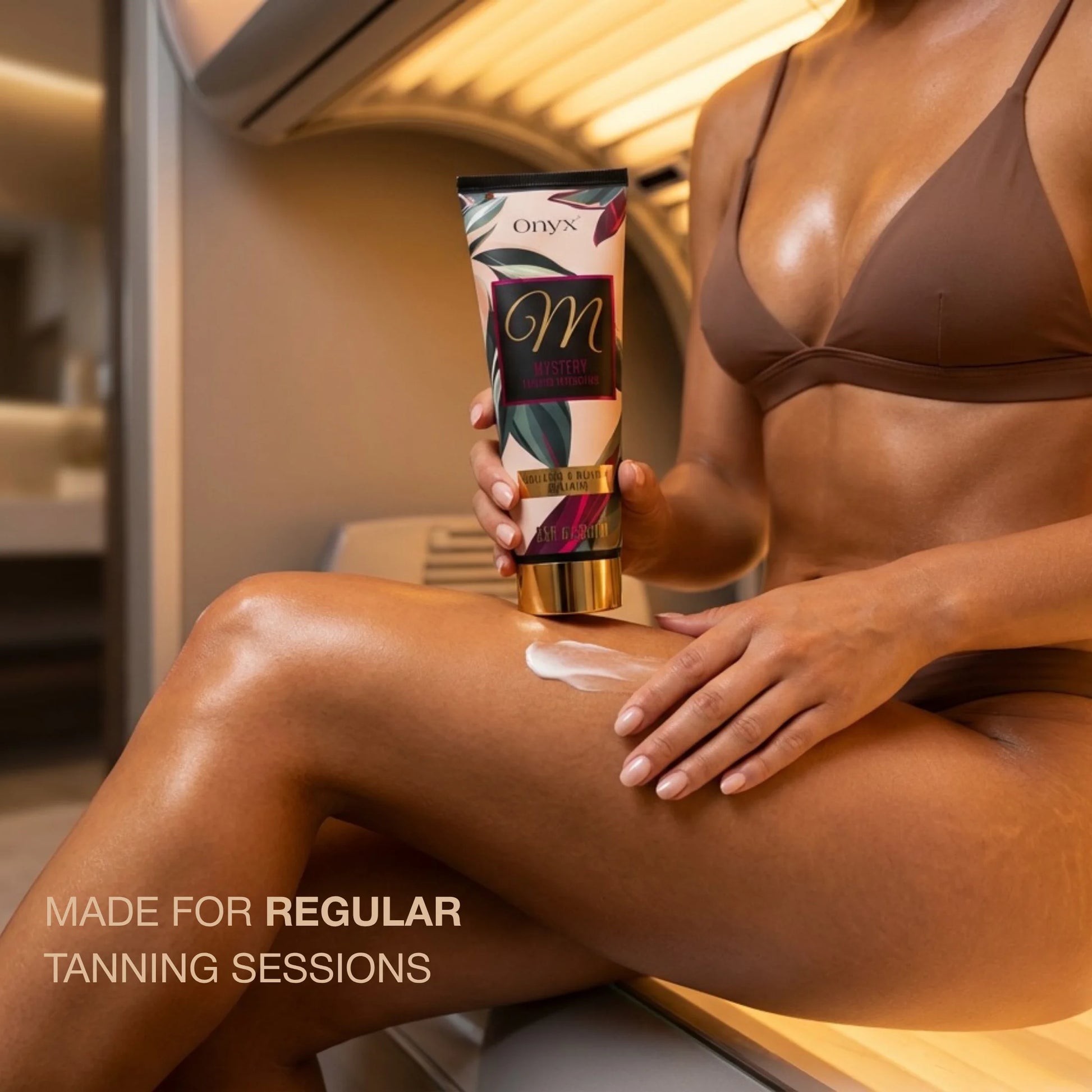 Woman applying white lotion from Onyx Mystery tanning intensifier on her leg while sitting in a sunbed