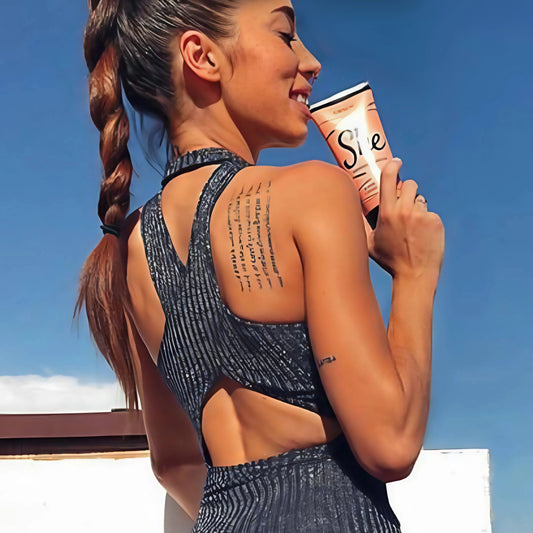 Onyx SHE bronzing intensifier tanning lotion in a peach and gold tube for a radiant tan.