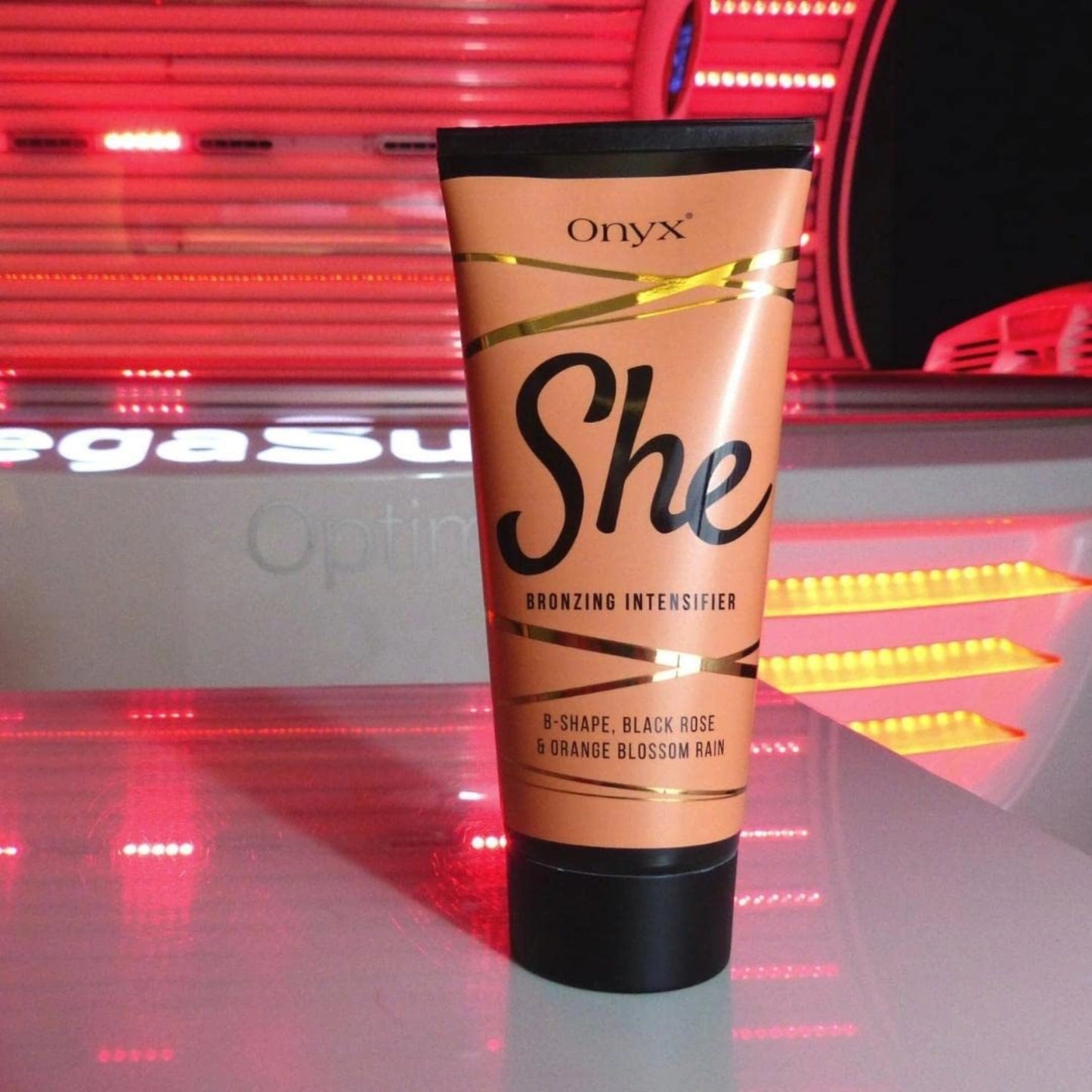 Onyx SHE bronzing intensifier lotion placed in a red-light sunbed tanning booth.