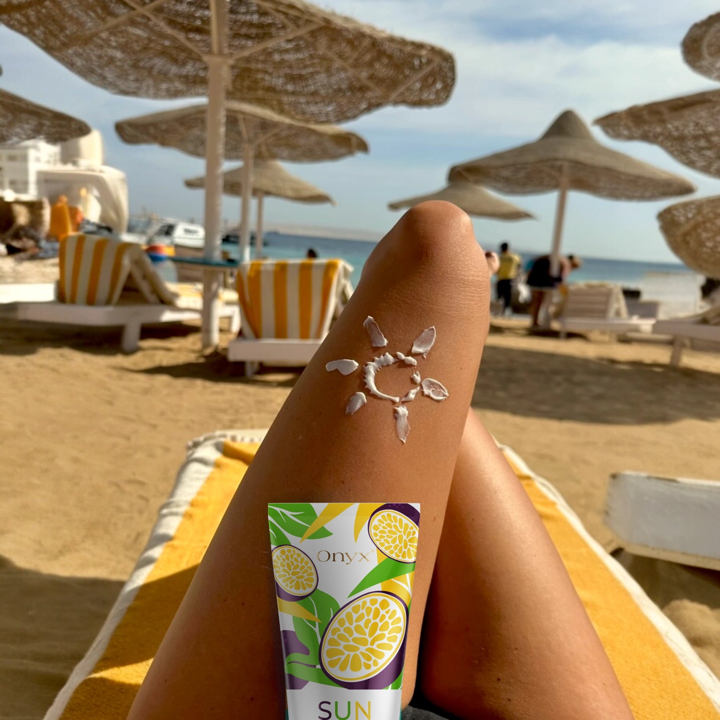 Onyx Suncolada tanning accelerator shown on sun-kissed leg with cream sun art, designed for outdoor tanning with natural oils and fast-absorbing vegan formula