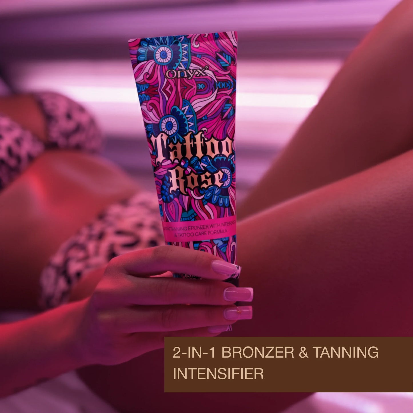 Close-up of hand holding tanning lotion in a tanning bed environment with pink lighting, skincare application concept.
