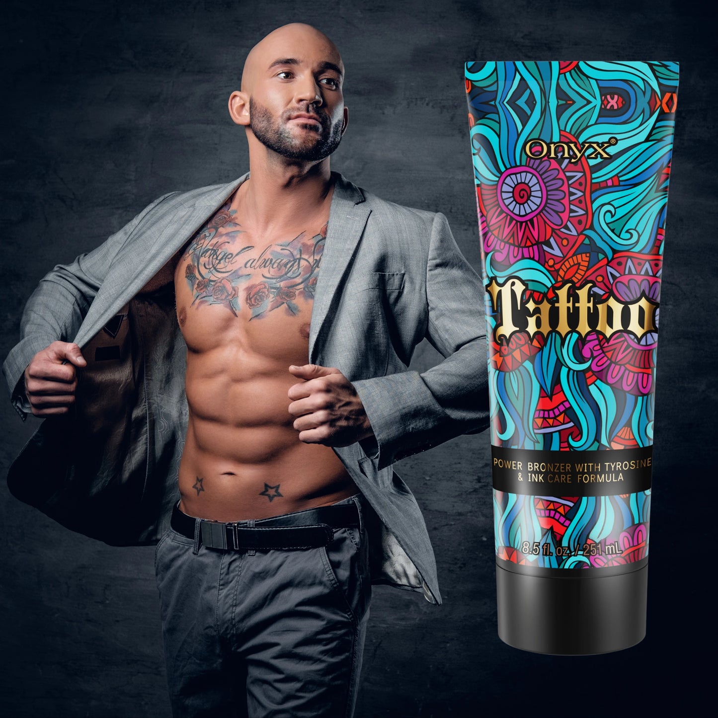 Onyx Tattoo Tanning Lotion with a tattooed male model in a suit, showcasing tattoo protection and bronzing power.